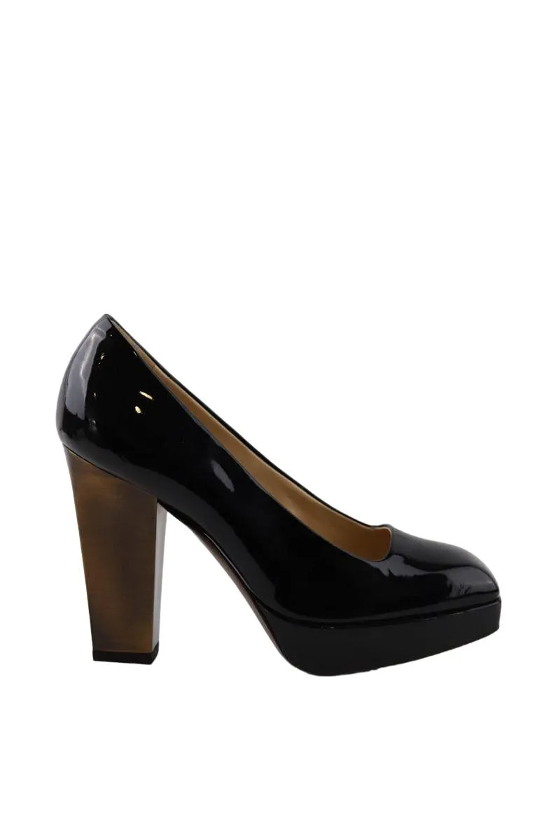 Talons en cuir verni Saint Laurent noir. Matière principale cuir verni. Taille 36.