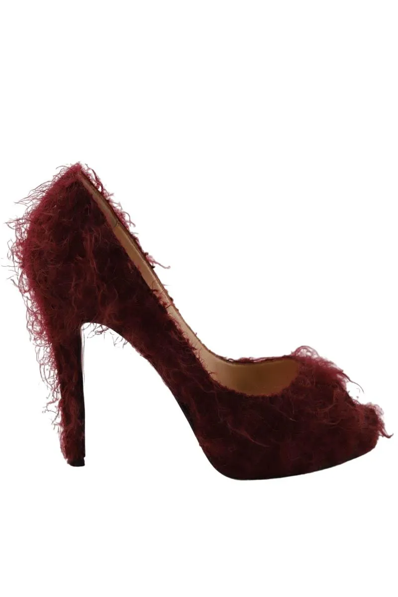 Talons en fourrure  Christian Louboutin bordeaux. Matière principale fourrure. Taille 36.